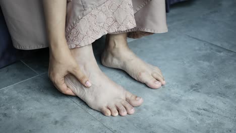 close up on women feet and hand massage on injury spot