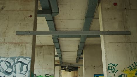 perspective of stark beams in an abandoned zagreb structure, croatia