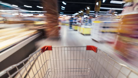 empty shopping cart in a busy grocery store