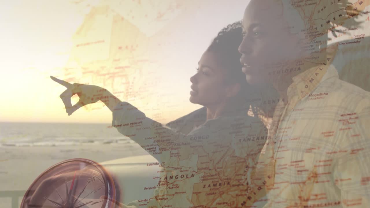 animación de una feliz pareja afroamericana disfrutando de la vista del atardecer en la playa sobre el mapa del mundo