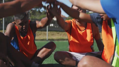 soccer players motivating on the field