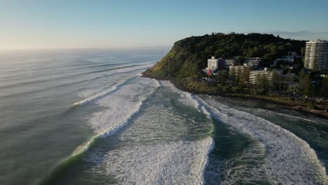 wide aerial shot moving towards burleigh heads, gold coast, australia