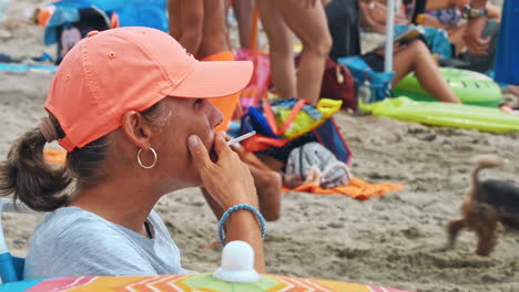 woman smoke on sunny summer day on the beach.