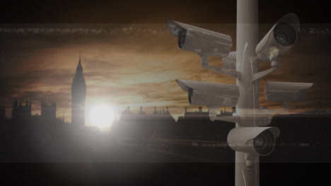 animation of moving cctv cameras over cityscape at sunset in the background