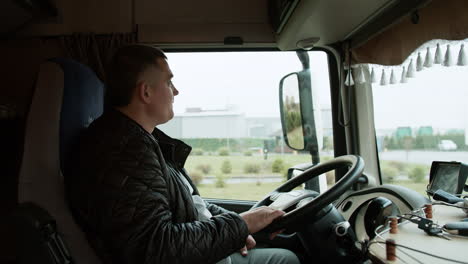 Man-resting-inside-of-a-truck