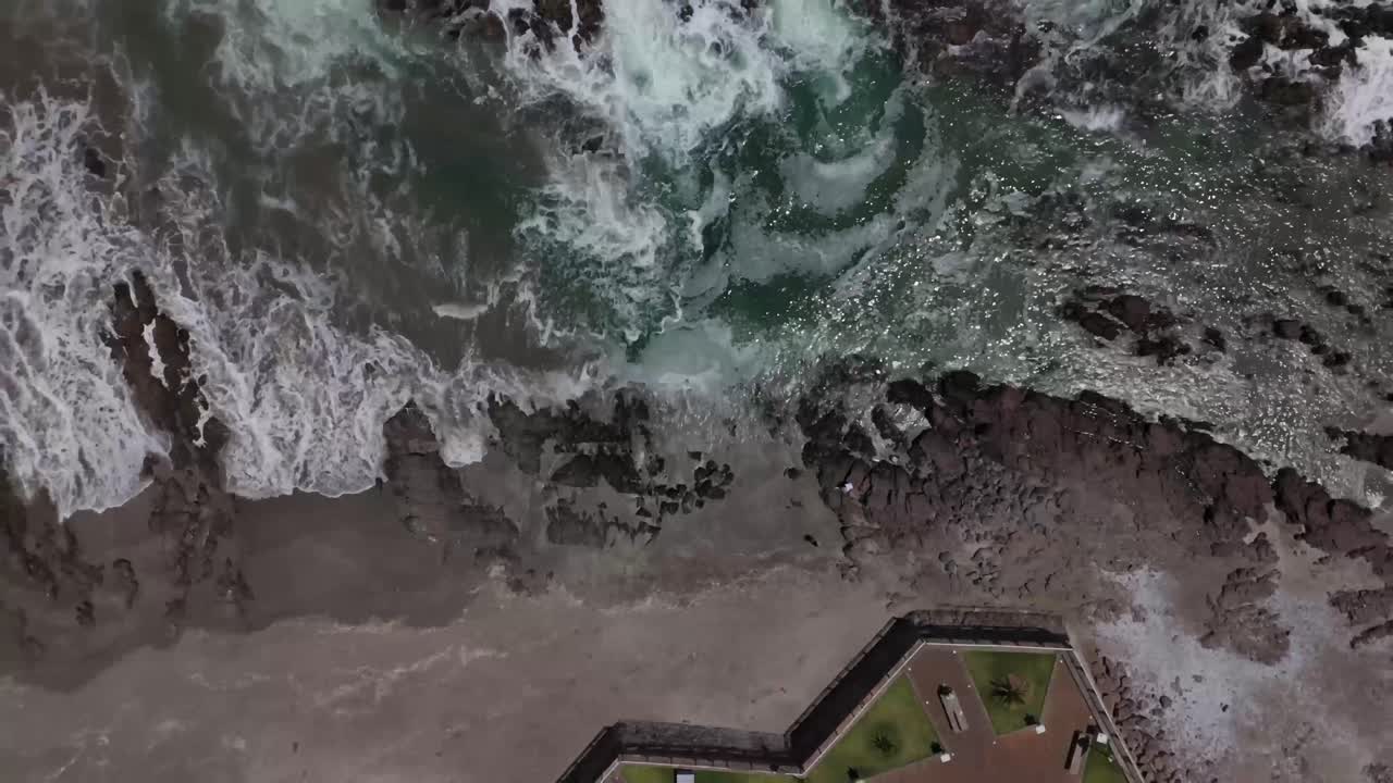 Iquique playa brava chile tarapaca cavancha day beach city rocks seafoam