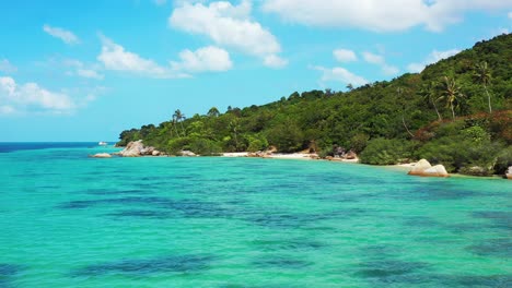 tropical island in the endless turquoise water