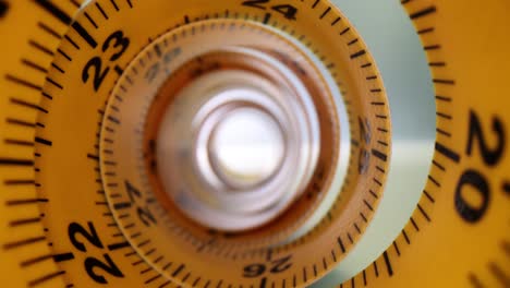 abstract view of a coiled yellow measuring tape