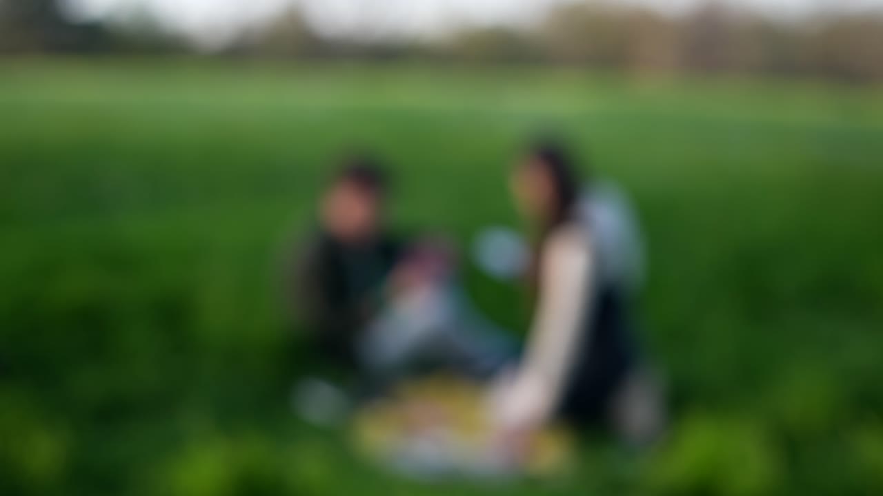 Couple playing cards in a park