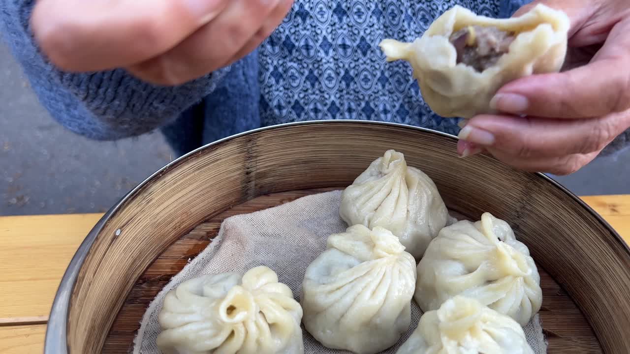 Eating steamed hot meat dumplings pelmeni