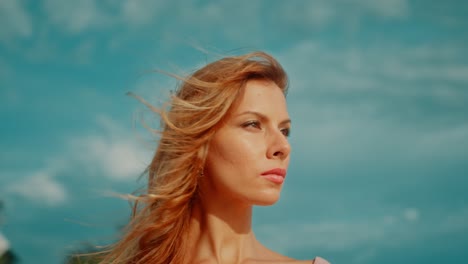woman with blonde hair and pink top