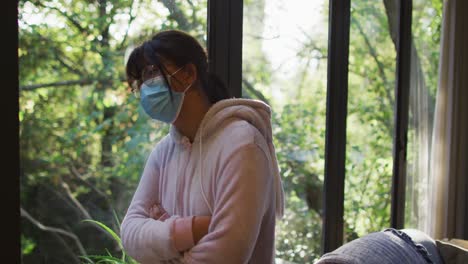 asian girl wearing face mask with arms crossed