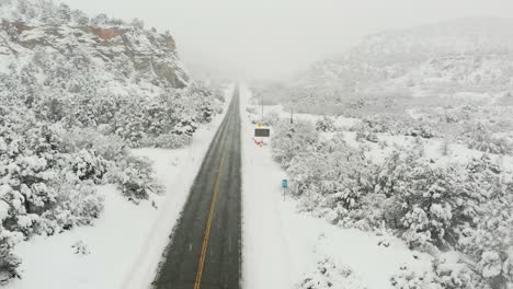 snow covered highway in the mountains