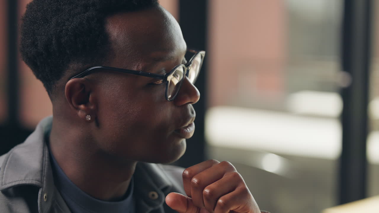 Portrait of an African American man wearing glasses