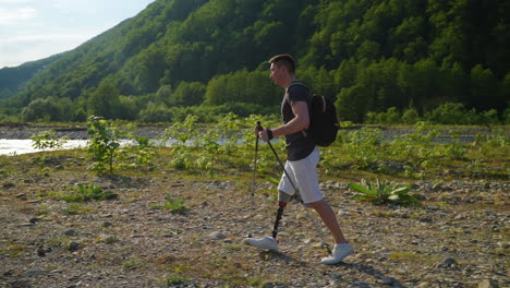 man with prosthetic leg hiking in mountains