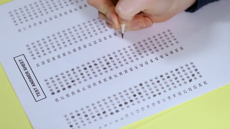 exam. filling in the test with a pencil. slow motion