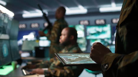 Army-operative-using-tablet-to-intercept-ballistic-rockets