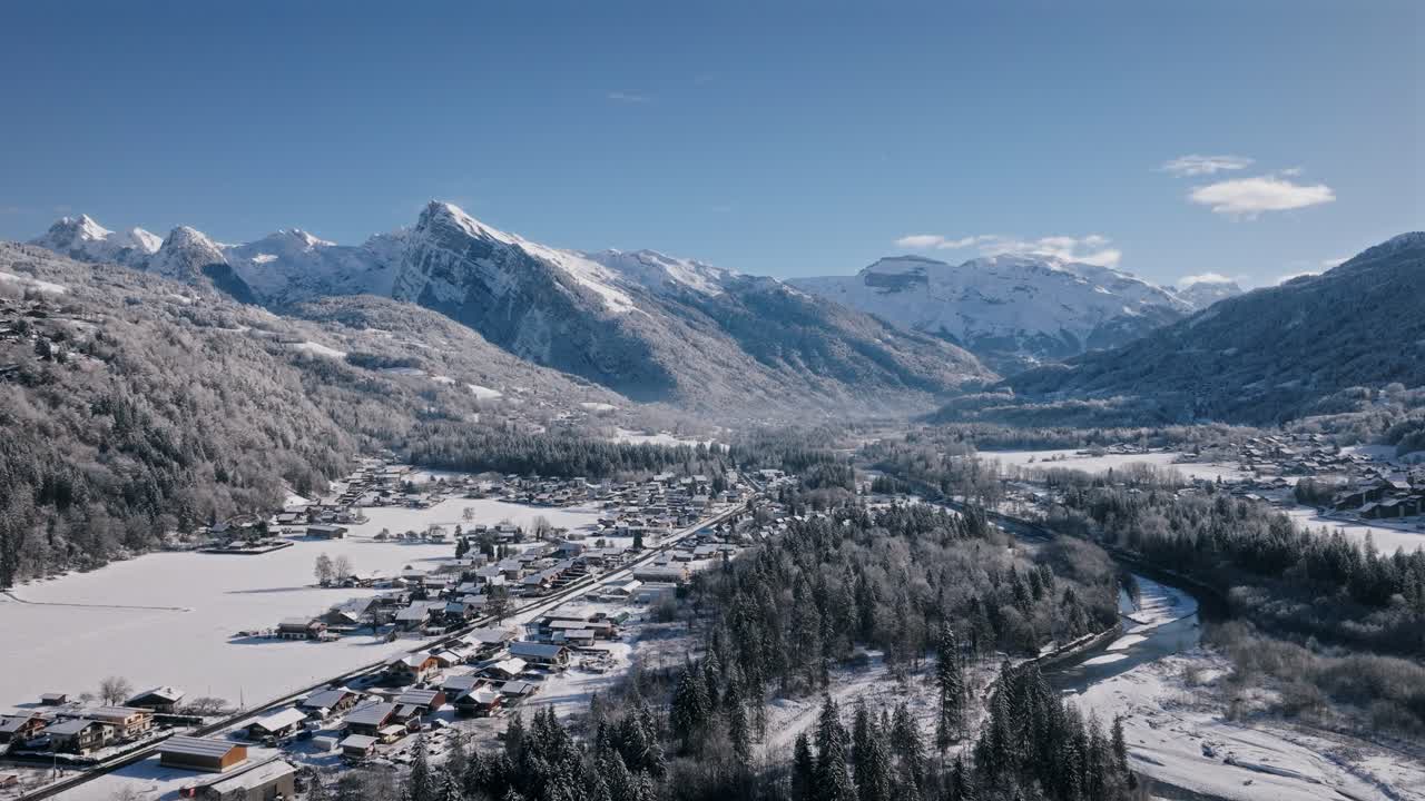 Beautiful snow-covered landscape in Giffre Valley with mountain views and village life
