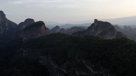 aerial: chinese karst mountain landscape at sunset