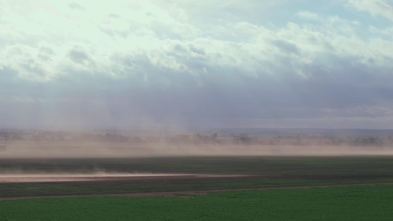 Dust storm sweeps over highway in rural Oklahoma, USA, evoking isolation