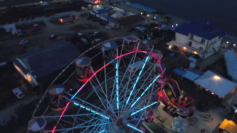 ferris wheel on the background of the sea at sunset. view from above