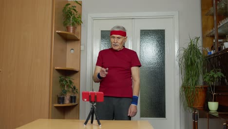 Senior-grandfather-man-doing-workout-training,-fitness,-sport-activity-at-home-during-coronavirus