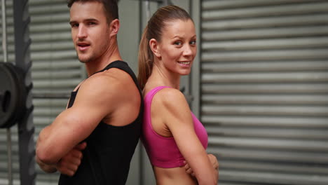 Couple-posing-at-crossfit-gym