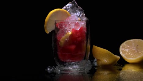 watermelon cubes in a frozen glass with ice melting on top