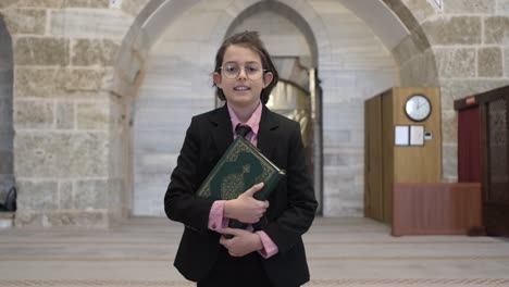 boy holding quran