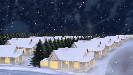 Snow-falling-over-multiple-houses-and-trees-on-winter-landscape-against-night-sky