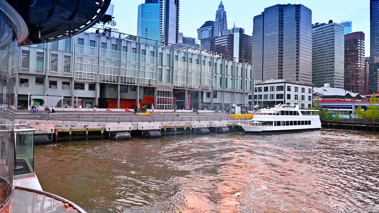 Setting off on the boat from the pier in New York, USA. Riverboat tour by modern metropolis