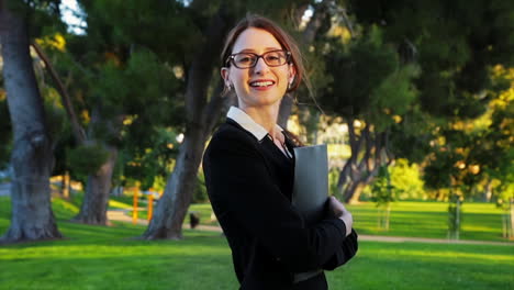 attractive caucasian business woman looks at the camera with a huge smile