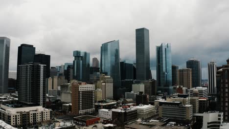 drone shot pulling away from houston's downtown district in texas