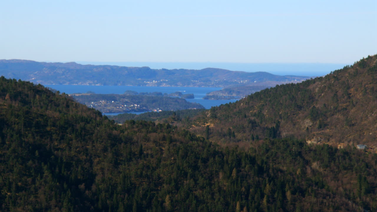 Long shot of Bjoroyna with Mountains in foreground. Filmed from Fløyen Panorama