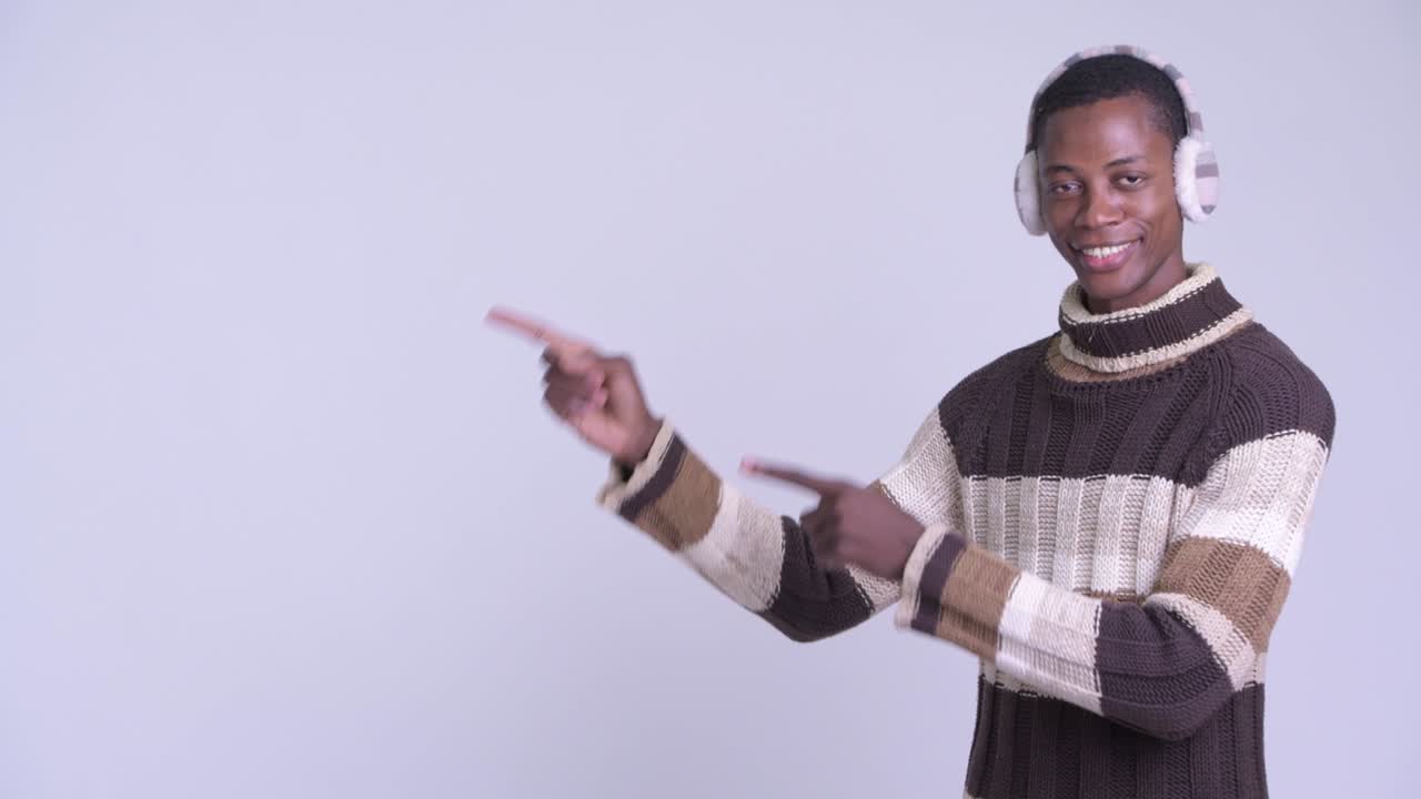 Young handsome African man ready for winter