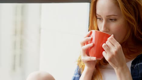 Woman-having-coffee-at-home-4k