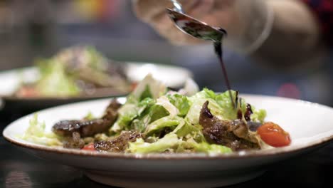 chef preparing a delicious salad with balsamic glaze