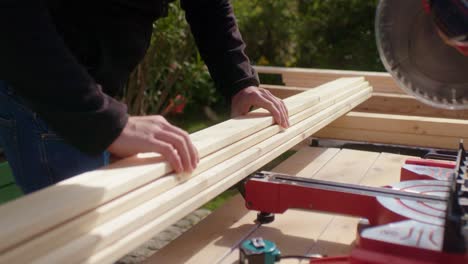 the stacked wood planks are prepared for sawing