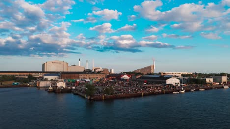 aerial view of a large crowd at a waterfront event