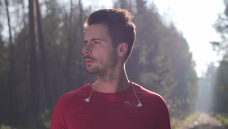 portrait of smiling runner in the forest