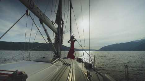 woman in red dress on a yacht