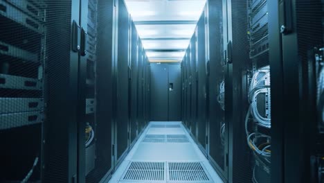 exploring a high-tech data center: a visual journey through rows of powerful servers and high-speed networking equipment illuminated by modern lighting