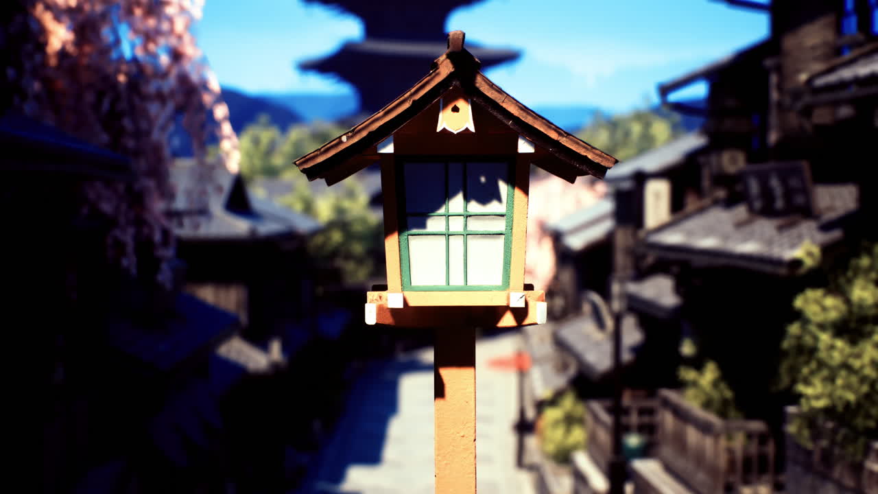 Traditional lantern stands in a serene street of an ancient town during daytime