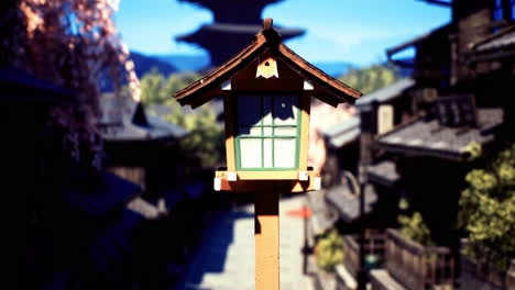 traditional lantern stands in a serene street of an ancient town during daytime