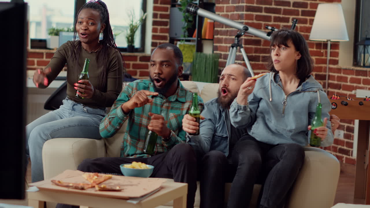 Group of football fans watching championship match