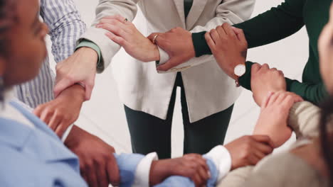 a diverse group of people joining arms in unity and collaboration