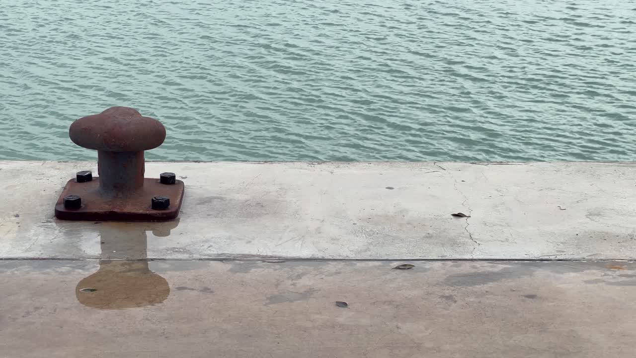 Close-up shot of a ship dock with blue water