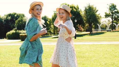 two women enjoying a sunny day in a park