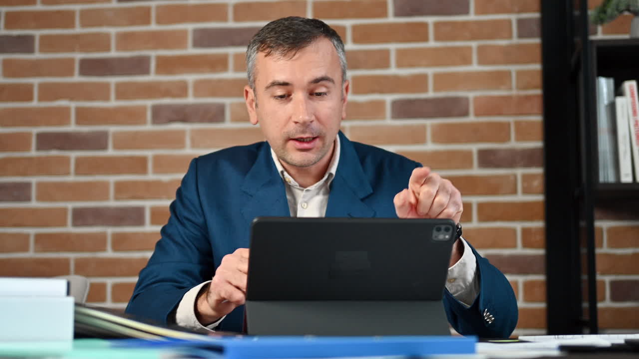 Man talking on a web conference at an office