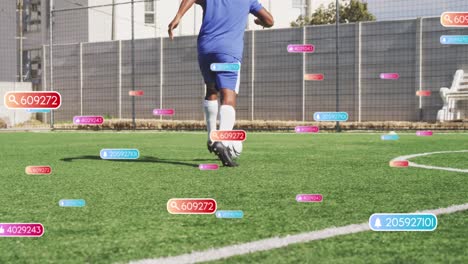 Social-media-concept-icons-against-african-american-male-soccer-player-practicing-on-sports-field